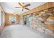 Sun room with stone wall and wood panels at 700 Stewart Rd, Covington, GA 30016