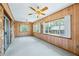 Bright sunroom with stone accents, wood paneling, and natural light at 700 Stewart Rd, Covington, GA 30016
