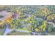 A serene aerial view of the lot, highlighted with a yellow border, and surrounded by lush, mature trees at 21 W Lake Dr, Oxford, GA 30054