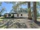 Backyard with trees, grass and back of house at 21 W Lake Dr, Oxford, GA 30054