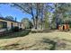 Spacious backyard with a shed and plenty of trees at 21 W Lake Dr, Oxford, GA 30054