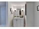 Modern bathroom featuring a single sink vanity with storage and a framed mirror at 21 W Lake Dr, Oxford, GA 30054