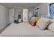 Bright bedroom features windows, decor, access to the bathroom, and a ladder with a towel at 21 W Lake Dr, Oxford, GA 30054