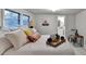 Bright bedroom featuring a large bed with decorative pillows and an adjacent bathroom at 21 W Lake Dr, Oxford, GA 30054