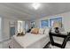 Bright bedroom features windows, decor, access to the bathroom, and a ladder with a towel at 21 W Lake Dr, Oxford, GA 30054