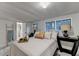 Bright bedroom features windows, decor, access to the bathroom, and a ladder with a towel at 21 W Lake Dr, Oxford, GA 30054