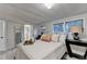 Bright bedroom features windows, decor, access to the bathroom, and a ladder with a towel at 21 W Lake Dr, Oxford, GA 30054