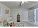 Bright bedroom featuring modern decor, light gray walls, and a ceiling fan with light at 21 W Lake Dr, Oxford, GA 30054