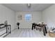 Home office area featuring modern decor, light gray walls, and bright natural light at 21 W Lake Dr, Oxford, GA 30054