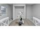 Dining room with a round table, chairs, a door leading outside, and laundry hookups at 21 W Lake Dr, Oxford, GA 30054