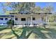 Charming single-story home featuring a welcoming front porch and well-maintained landscaping at 21 W Lake Dr, Oxford, GA 30054