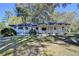 Inviting single-story home with a covered front porch and lush green lawn, perfect for relaxation at 21 W Lake Dr, Oxford, GA 30054