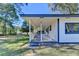 Spacious covered front porch offering a relaxing outdoor living space with beautiful views at 21 W Lake Dr, Oxford, GA 30054