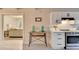 Bright kitchen features quartz counters, stainless steel appliances and views to living room at 21 W Lake Dr, Oxford, GA 30054