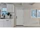 Modern kitchen features white cabinetry, sleek countertops, and stylish black fixtures at 21 W Lake Dr, Oxford, GA 30054