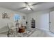 Bright sitting room with two armchairs, decorative rug, and natural light from a window, perfect for conversation at 21 W Lake Dr, Oxford, GA 30054