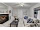 Inviting living room with a fireplace, plush sofa, and stylish decor, creating a cozy retreat for relaxing at 21 W Lake Dr, Oxford, GA 30054