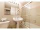 Cozy tiled bathroom featuring a pedestal sink and shower-tub combo at 2285 Peachtree Ne Rd # 604, Atlanta, GA 30309