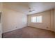 This carpeted bedroom features natural light with a ceiling fan and neutral walls at 2285 Peachtree Ne Rd # 604, Atlanta, GA 30309