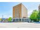 Daytime view of a high-rise condominium building with prominent street presence and commercial spaces at 2285 Peachtree Ne Rd # 604, Atlanta, GA 30309