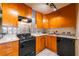 Kitchen featuring track lighting, light-colored countertops, wooden cabinets, and modern appliances at 2285 Peachtree Ne Rd # 604, Atlanta, GA 30309