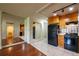 Open concept kitchen features light-colored tile flooring, modern appliances, and wooden cabinets at 2285 Peachtree Ne Rd # 604, Atlanta, GA 30309