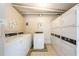 Clean community laundry room with multiple rows of washers and dryers for resident convenience at 2285 Peachtree Ne Rd # 604, Atlanta, GA 30309