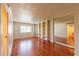 Spacious living room featuring hardwood floors, built-in shelving, and a window for ample natural light at 2285 Peachtree Ne Rd # 604, Atlanta, GA 30309