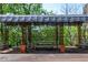Charming outdoor dining area with a shaded pergola, offering a peaceful space for residents at 2285 Peachtree Ne Rd # 604, Atlanta, GA 30309