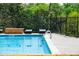 Exterior shot of a clear blue pool and lounge seating near the building at 2285 Peachtree Ne Rd # 604, Atlanta, GA 30309