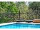 Exterior shot of a clear blue pool and lounge seating near the building at 2285 Peachtree Ne Rd # 604, Atlanta, GA 30309