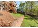A multi-level backyard with a retaining wall and stairs leading to the upper deck at 482 Cooper Lake Se Rd, Smyrna, GA 30126