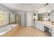 Luxurious bathroom featuring a soaking tub, separate shower, and double vanity at 482 Cooper Lake Se Rd, Smyrna, GA 30126
