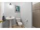 Bathroom with neutral gray walls, pedestal sink, and step in shower at 482 Cooper Lake Se Rd, Smyrna, GA 30126