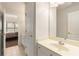 Bright bathroom with tile flooring and vanity, adjacent to bedroom at 482 Cooper Lake Se Rd, Smyrna, GA 30126