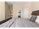 Neutral bedroom featuring carpet flooring, a large bed, and natural light at 482 Cooper Lake Se Rd, Smyrna, GA 30126