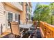 A wooden deck features an outdoor table with seating and an umbrella attached to the home at 482 Cooper Lake Se Rd, Smyrna, GA 30126