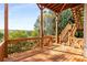 A spacious wooden deck with stairs and a view of the surrounding trees and landscaping at 482 Cooper Lake Se Rd, Smyrna, GA 30126