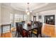 Formal dining room with large windows, hardwood floors, and access to a private office at 482 Cooper Lake Se Rd, Smyrna, GA 30126