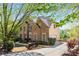 A front exterior view of a two-story brick and siding home with a well-kept lawn at 482 Cooper Lake Se Rd, Smyrna, GA 30126