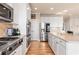 Modern kitchen with stainless steel appliances, ample cabinet space, and a functional layout at 482 Cooper Lake Se Rd, Smyrna, GA 30126