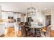 The kitchen has stainless appliances, modern lighting, breakfast nook, and light cabinets at 482 Cooper Lake Se Rd, Smyrna, GA 30126