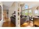 Open-concept living area featuring hardwood floors, large windows, and stylish furnishings at 482 Cooper Lake Se Rd, Smyrna, GA 30126