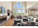 Bright and airy living room with large windows, fireplace, and comfortable seating area at 482 Cooper Lake Se Rd, Smyrna, GA 30126