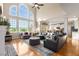 Open living room with vaulted ceilings, fireplace, and seamless flow to the kitchen area at 482 Cooper Lake Se Rd, Smyrna, GA 30126