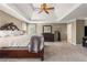 Bright main bedroom with a large bed, walk-in closet, and carpet flooring at 482 Cooper Lake Se Rd, Smyrna, GA 30126