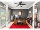 Home office with French doors, built-in shelves, neutral decor, and ceiling fan at 482 Cooper Lake Se Rd, Smyrna, GA 30126
