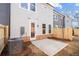 View of the backyard with privacy fence and concrete patio perfect for entertaining at 1016 Rose Dr, Marietta, GA 30060