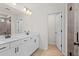 Modern bathroom with double vanity, framed mirror, and a glass-enclosed shower at 1016 Rose Dr, Marietta, GA 30060