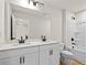 Bathroom with double vanity and combined shower and bathtub at 1016 Rose Dr, Marietta, GA 30060